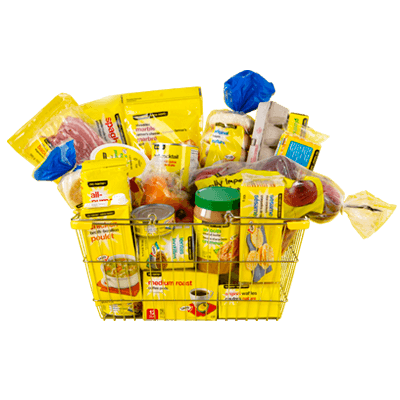 A grocery basket overflowing with No Name products including peanut butter, apples, bacon, coffee and more surrounded by a yellow background.